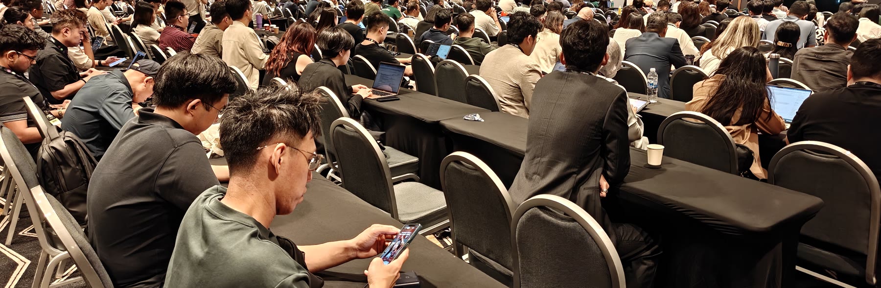 A packed room of traders at their desks
