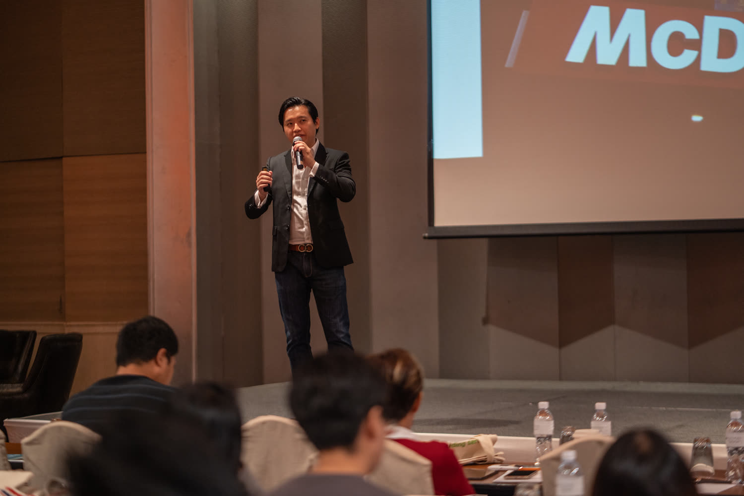 Ezekiel Chew presenting on stage